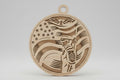 Wooden pendant with flag design on a wooden surface