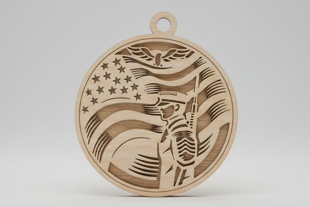 Wooden pendant with flag design on a wooden surface