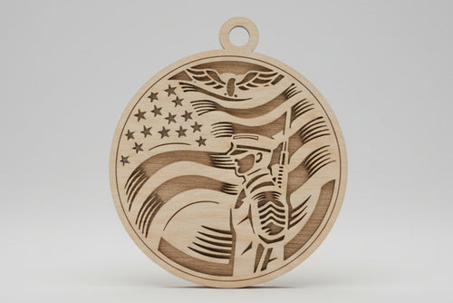 Wooden pendant with flag design on a wooden surface