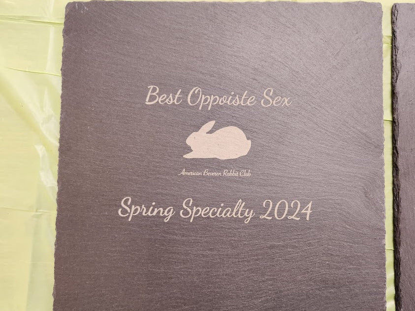 Slate tile with  text and rabbit illustration on a light green background