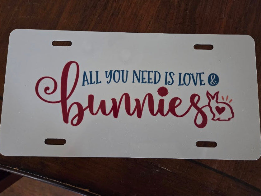 License plate with decorative text on a wooden surface