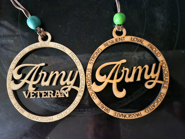 Two circular wooden pendants with Army  or Army Veteran text on a dark background