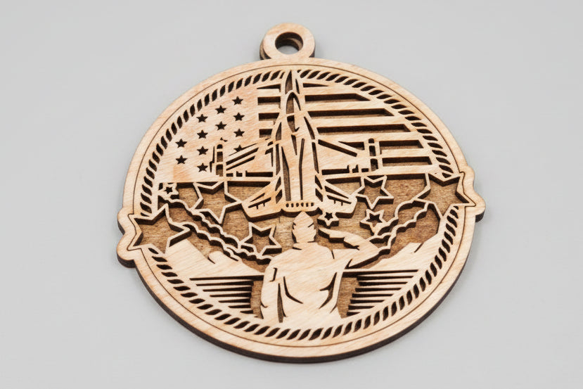 Wooden ornament with engraved design on a wooden surface