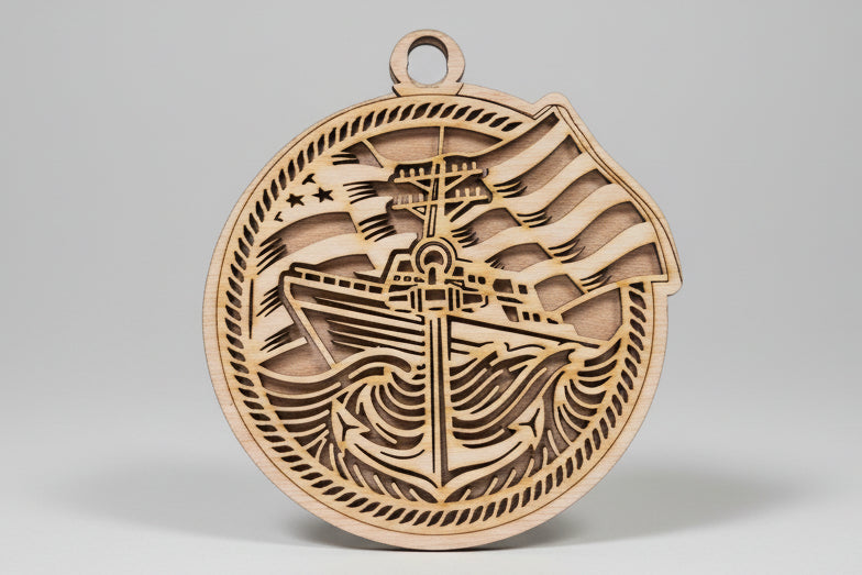 Wooden pendant with intricate carvings on a wooden surface