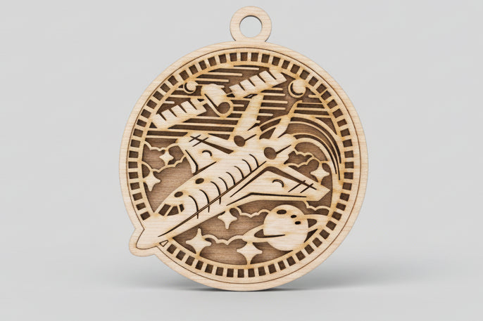 Wooden pendant with intricate cut-out design on a wooden surface
